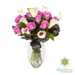 Bouquet of white calla lilies and pink roses, online flower delivery, online sales, home delivery to Pisa, Rome, Bari, Perugia, Varese, Ferrara.
