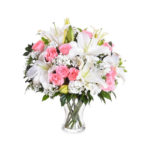Composizione funebre con Lilium bianco e rose rosa