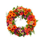 Red funeral wreath with gerberas and roses for home delivery throughout italy, church and funeral